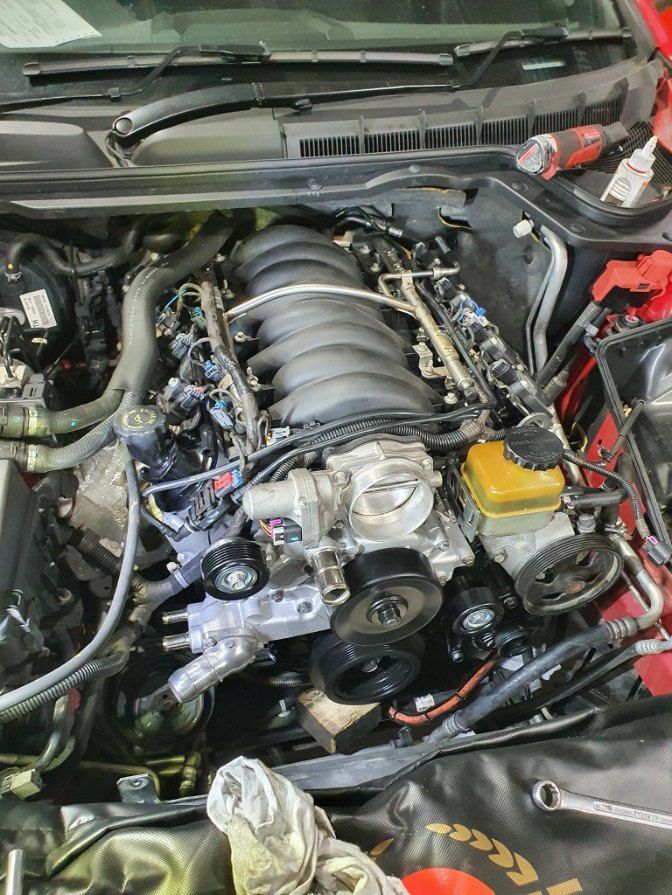 The Engine of a Car is Being Worked on by a Mechanic — All Care Car Services Kumho Tyre Platinum Dealer in Kurri Kurri, NSW