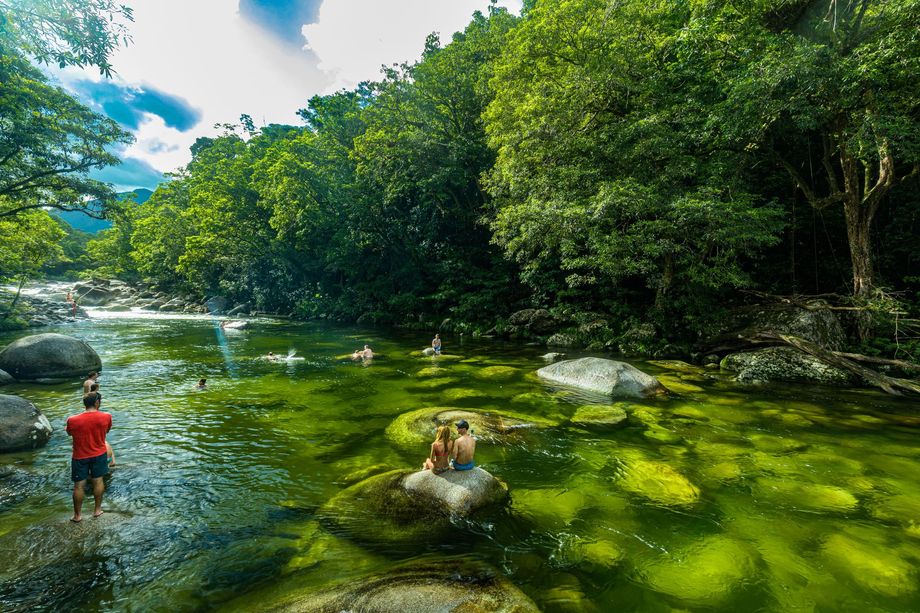 Tourists enjoying a swim in the crystal clear waters of Mossman Gorge, Daintree Rainforest FNQ