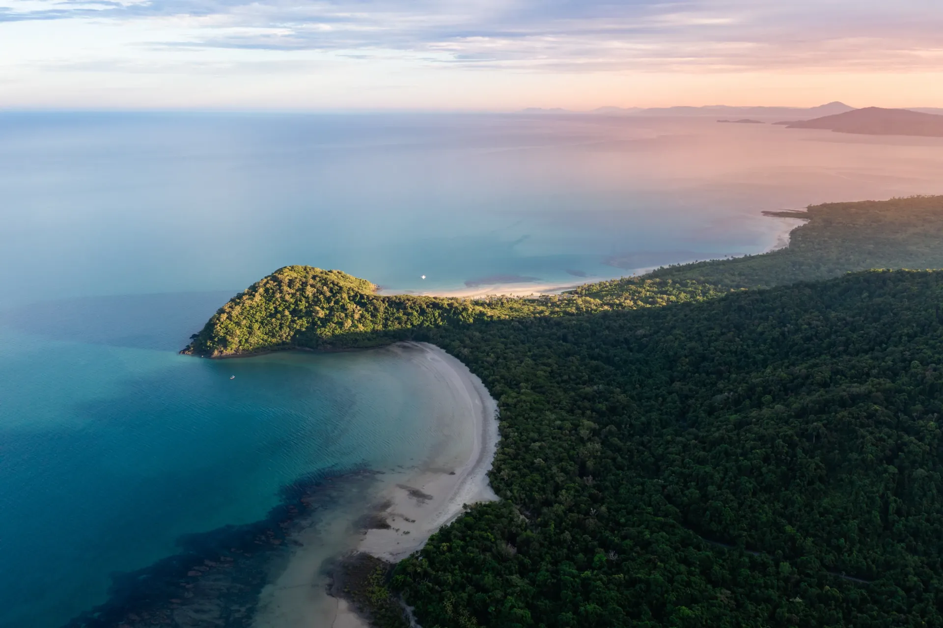 Aerial view of Cape Tribulation in the Daintree Rainforest, where the rainforest meets the reef