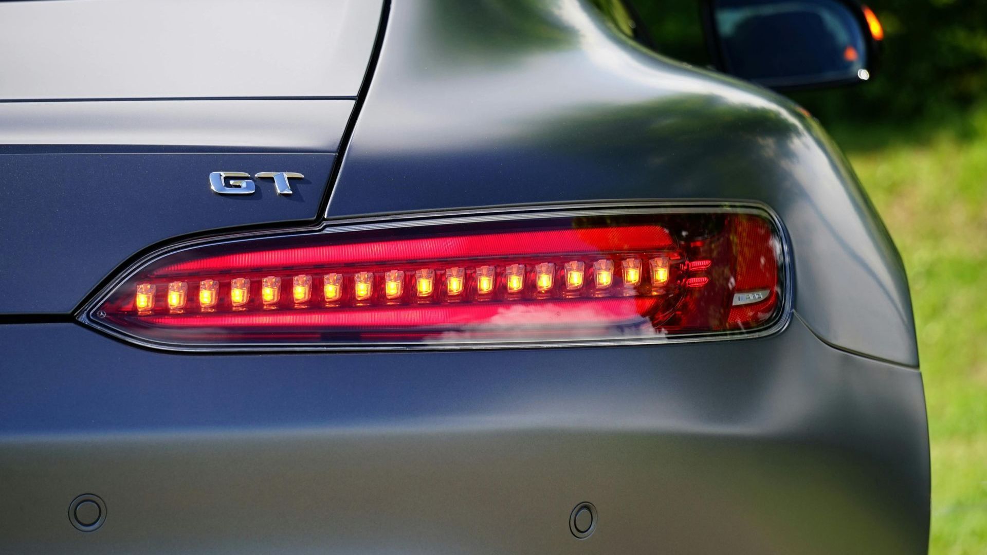 A close up of s car breaklight and indicator light mercedes benz gt.