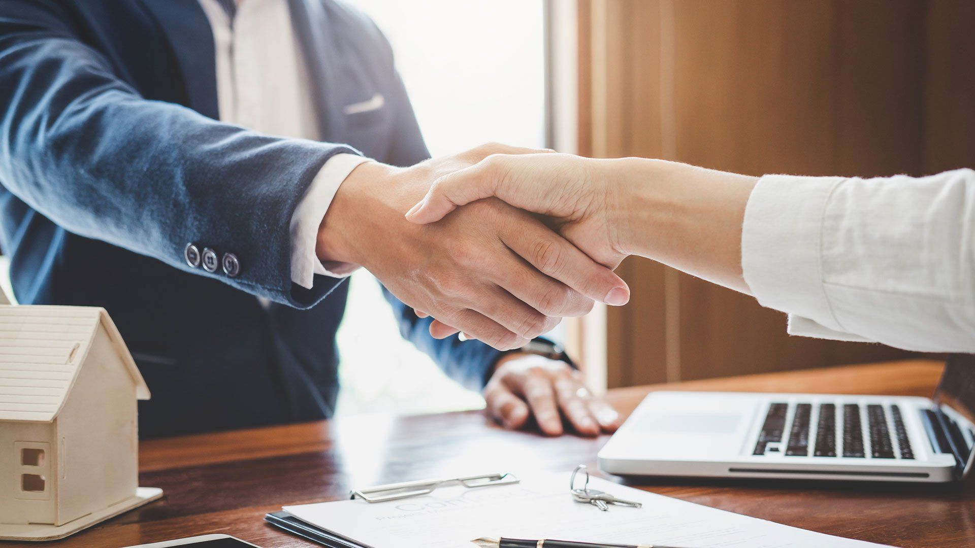 Handshake with Real Estate Lawyer — Oakland, CA — Law Offices of Mark E Rubke