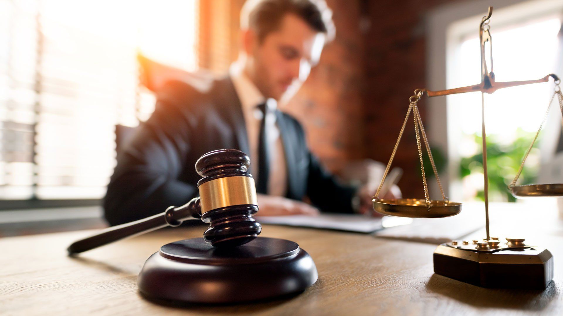 Gavel and Scale on Lawyer's Table — Oakland, CA — Law Offices of Mark E Rubke