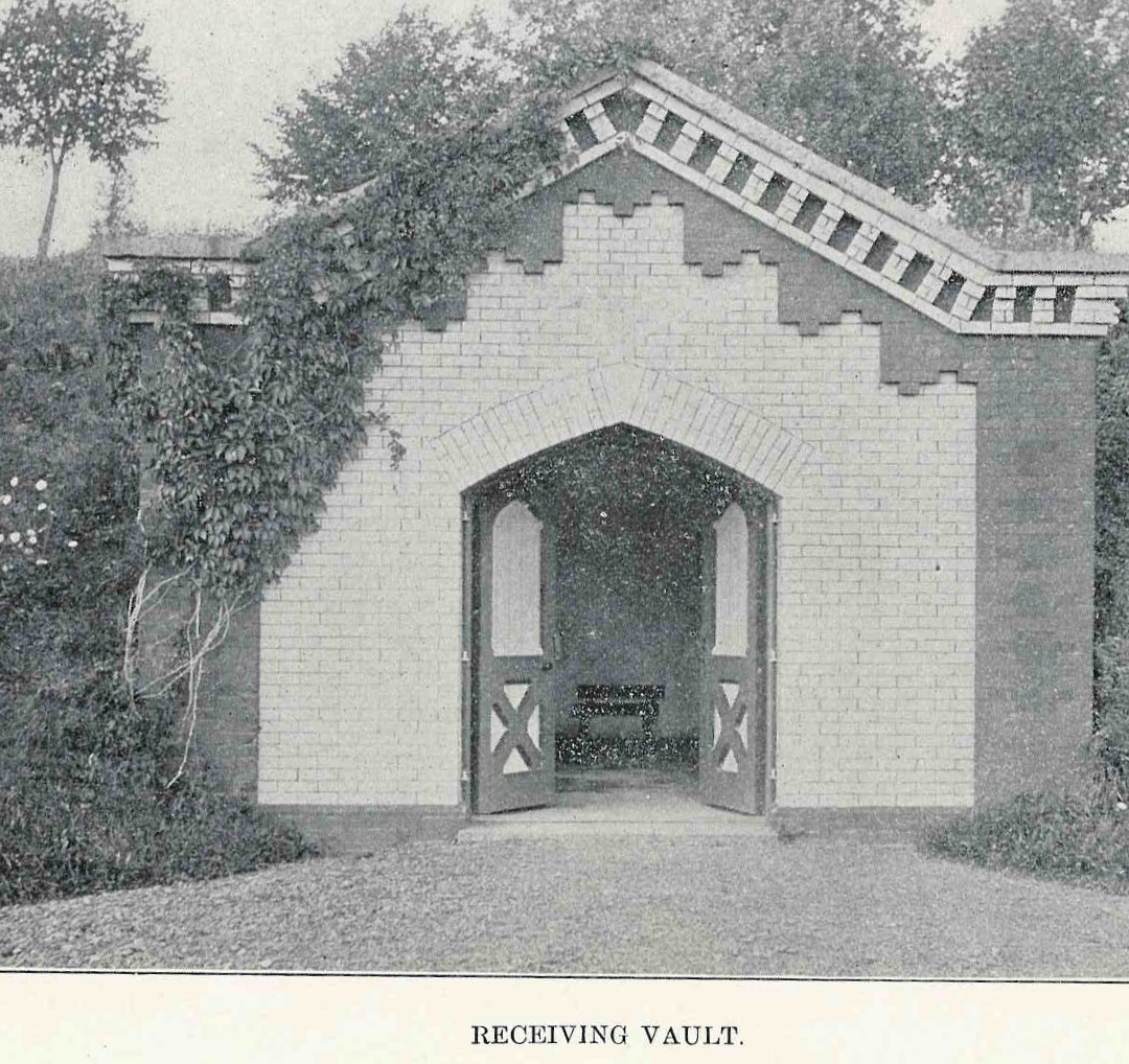A black and white photo of a building with the word vault on the bottom