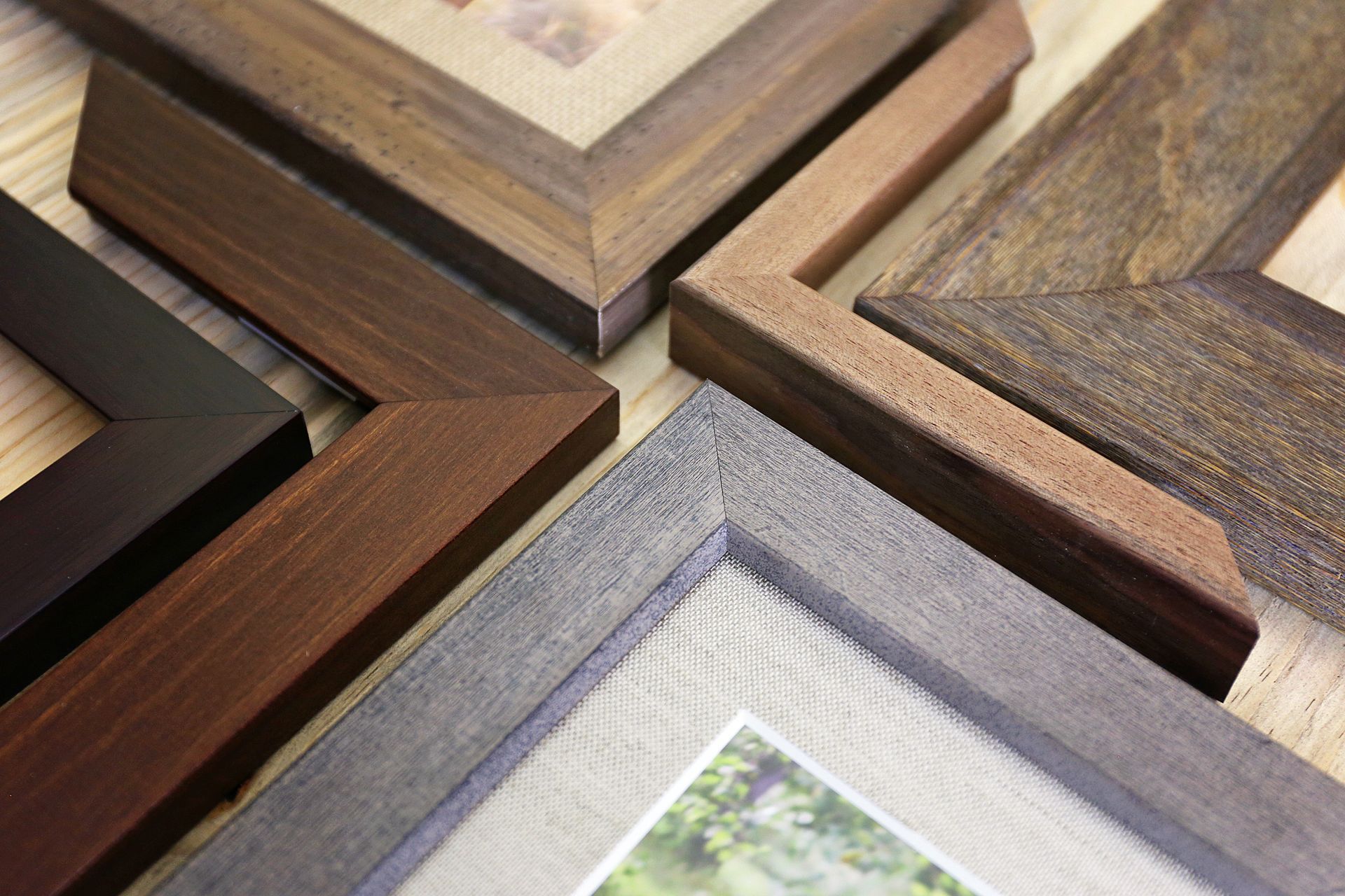 Close-up of high-quality hardwood corner samples for handcrafted custom photo frames.