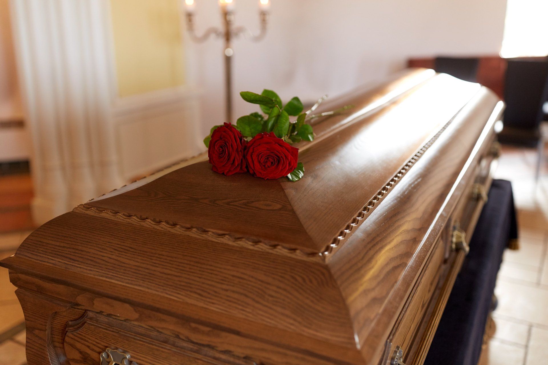 casket with red roses