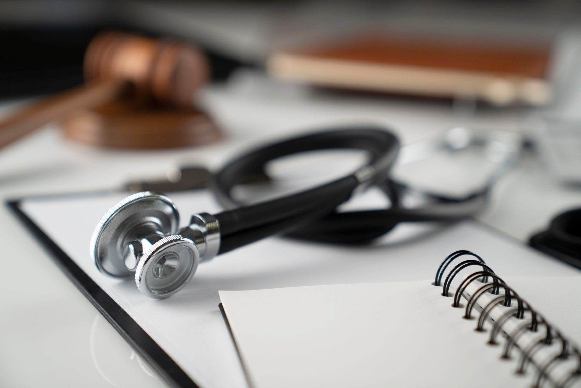 stethoscope on top of notebook to show medical malpractice