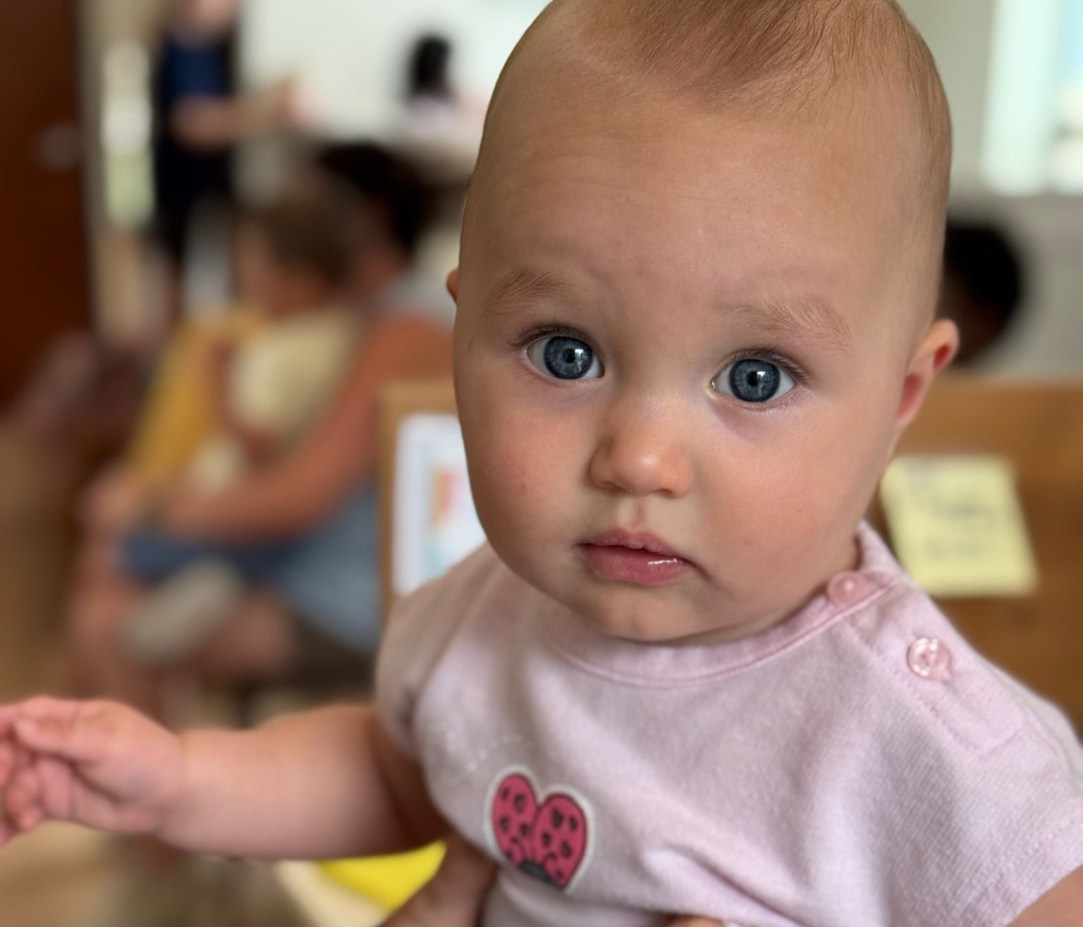 A little girl with blue eyes inside Living Water Chiropractic