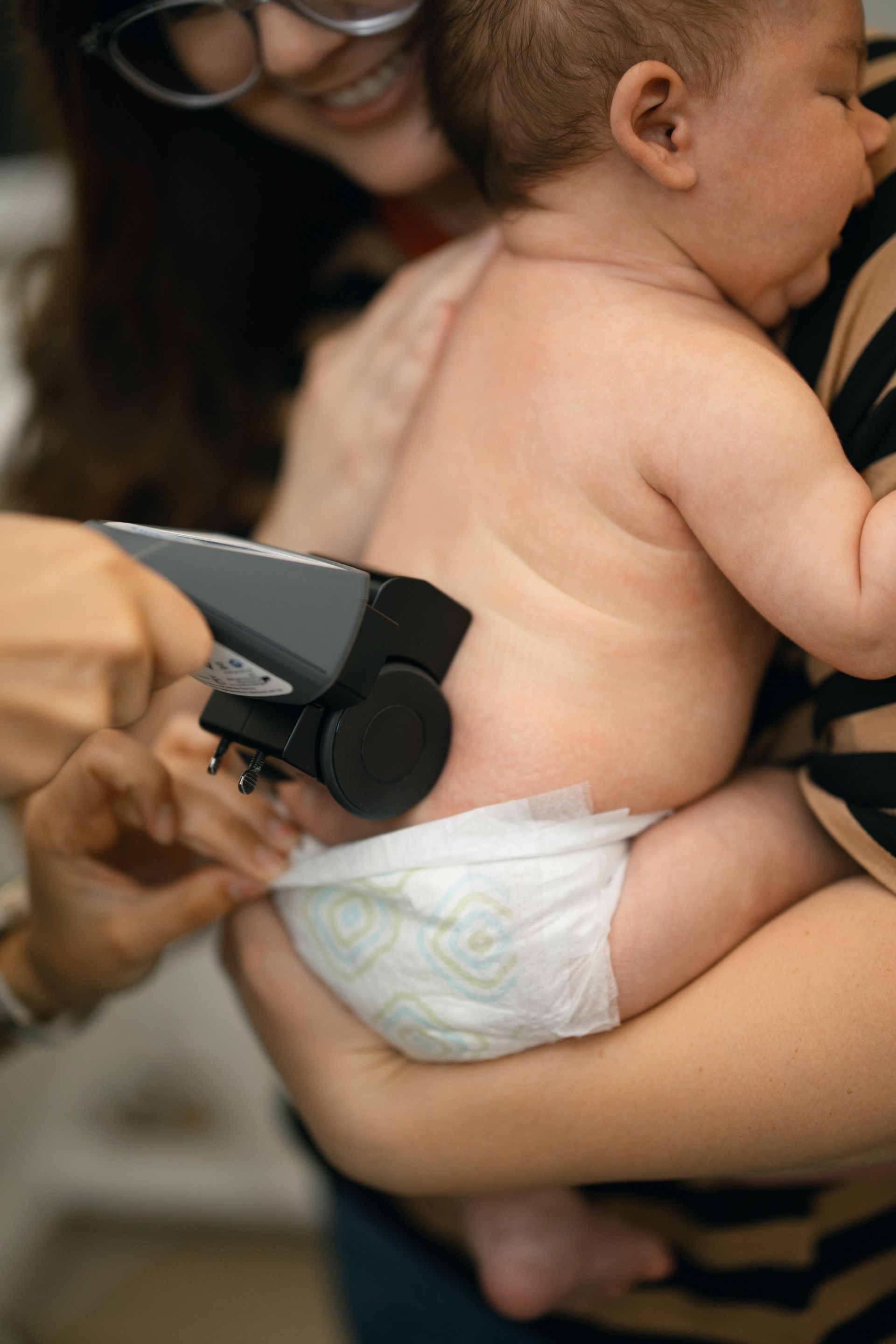 Baby in Infant receiving a CLA InSight Scan at Living Water Chiropractic