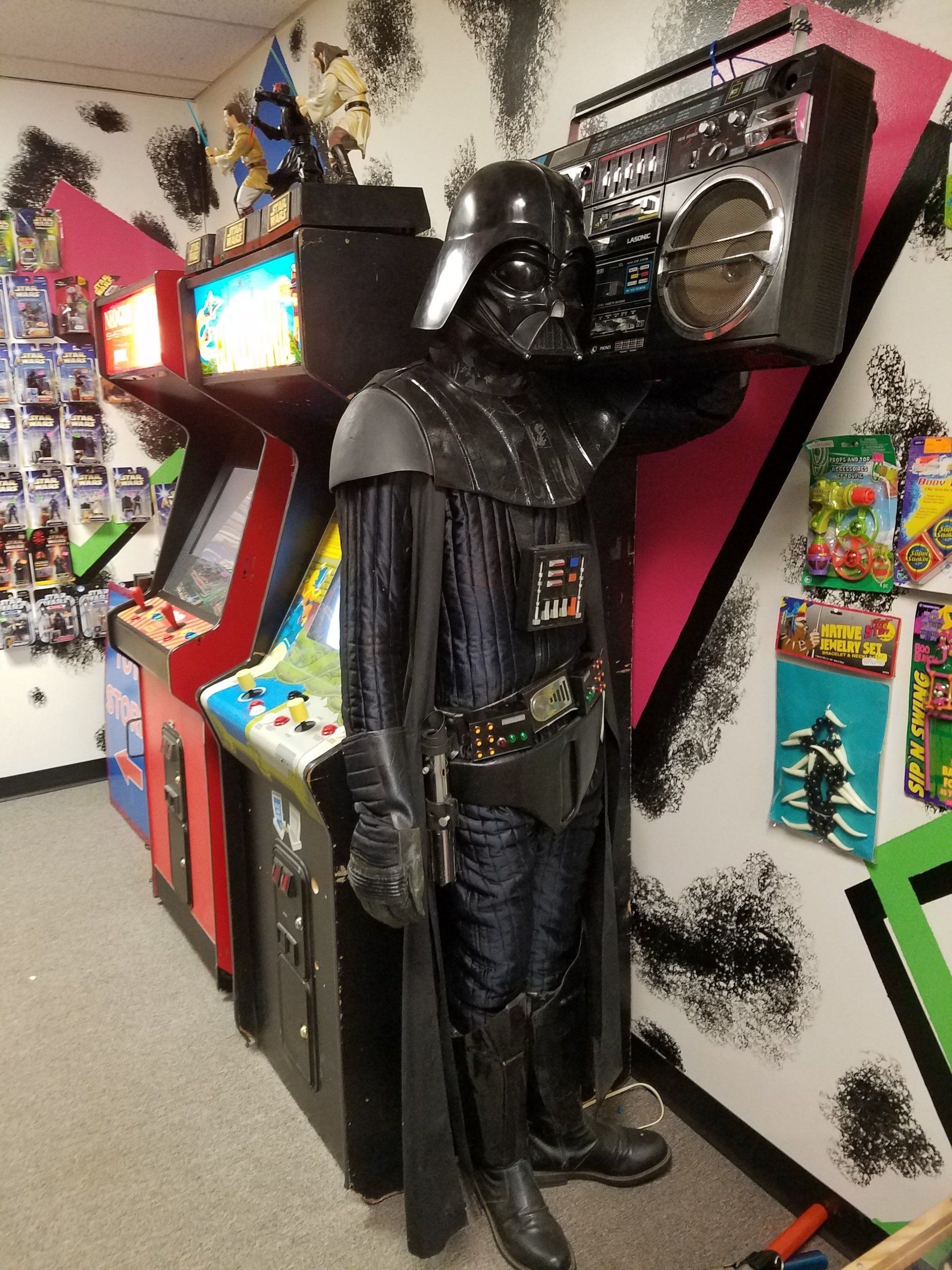 Darth Vader holding Boom Box with arcade games!
