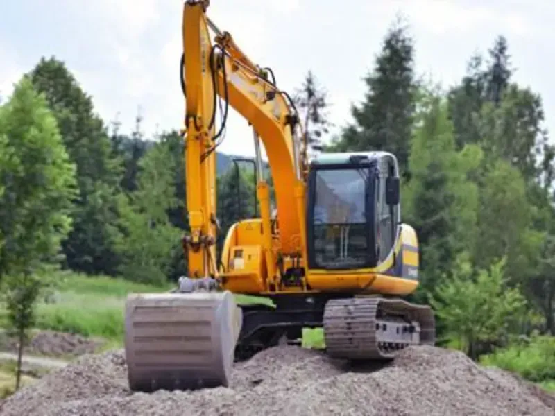 Pre-construction Tree Mitigation first before using the yellow excavator in Humble TX.
