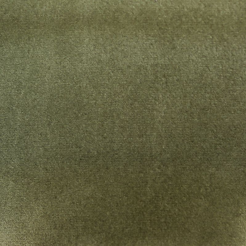 Detailopname van een olijfgroene stof of oppervlak met textuur.