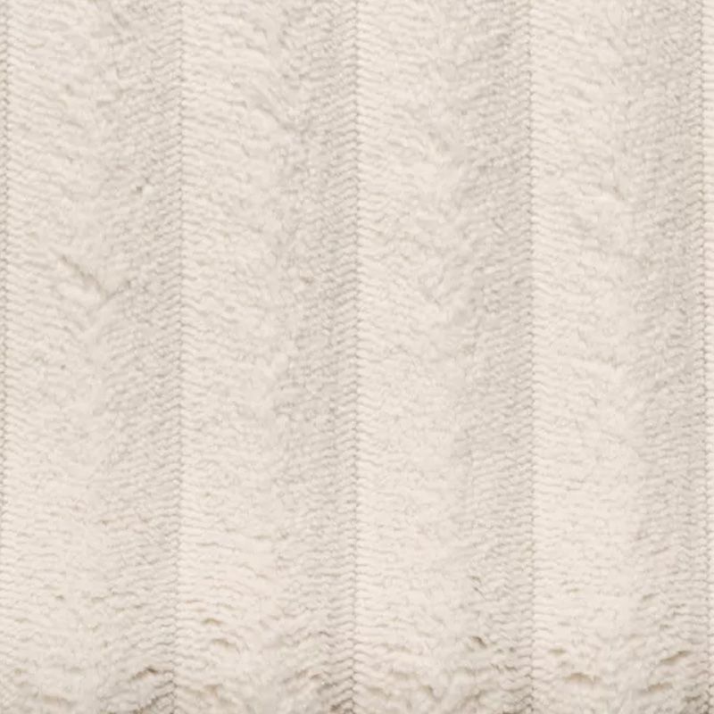Lichtbeige, gestructureerde stof met subtiele verticale zigzagweefpatronen.