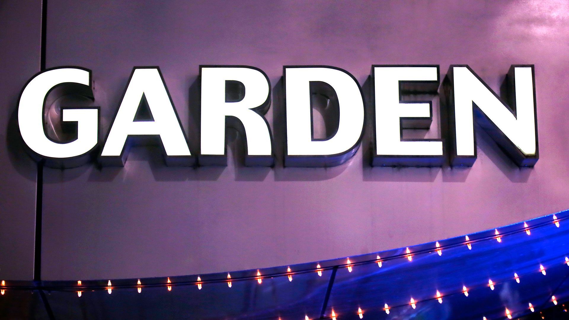 A vibrant garden restaurant in downtown, showcasing custom signs in Raleigh, NC