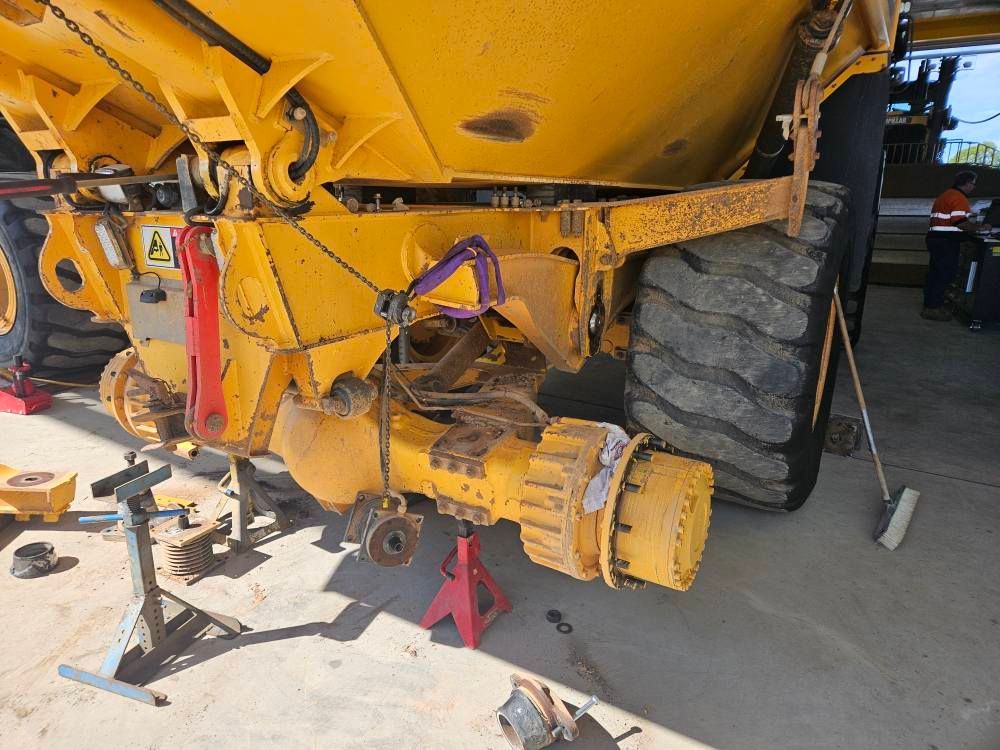 Yellow Construction Vehicle's Rear Axle Undergoing Repair — Cap Coast Maintenance in Alton Downs, Qld