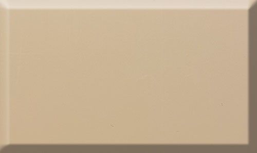 Cream-colored rectangular tile with a beveled edge, casting a shadow.