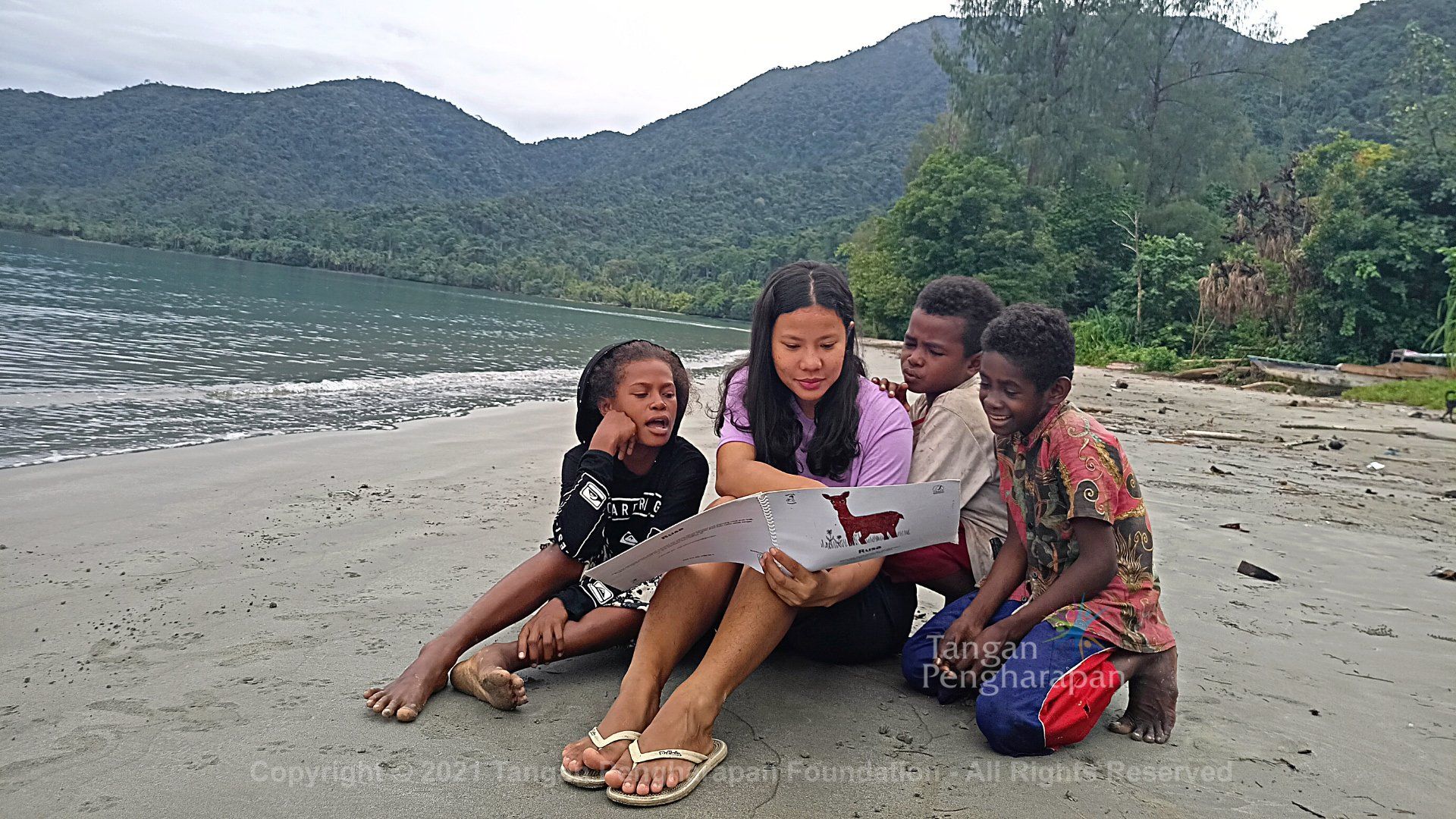 A Girl Teaching the Students on the Beach — Safety Boots in Jakarta Indonesia