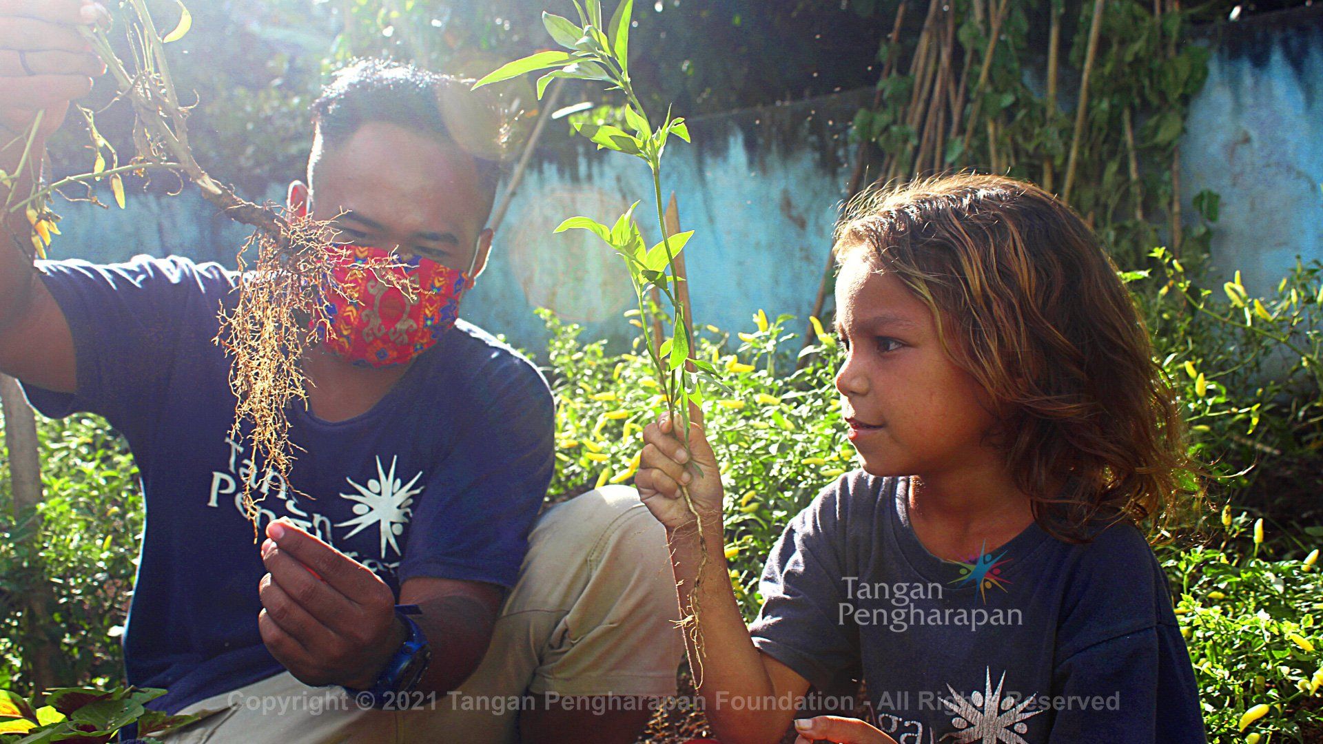 A Man Showing a Plant to a Girl — Safety Boots in Jakarta Indonesia