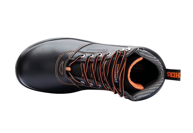 The bottom of a black boot with orange laces on a white background.