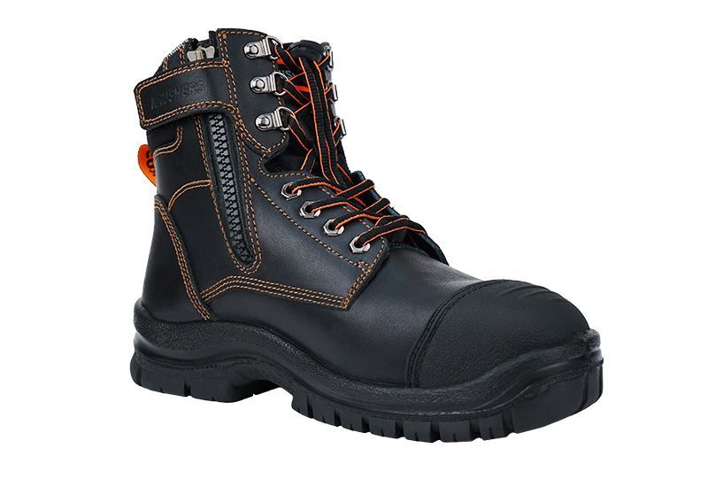 A pair of black and orange safety boots on a white background