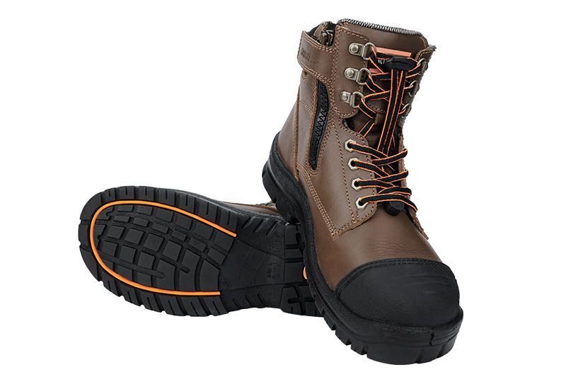 A pair of brown safety boots with a black sole on a white background.