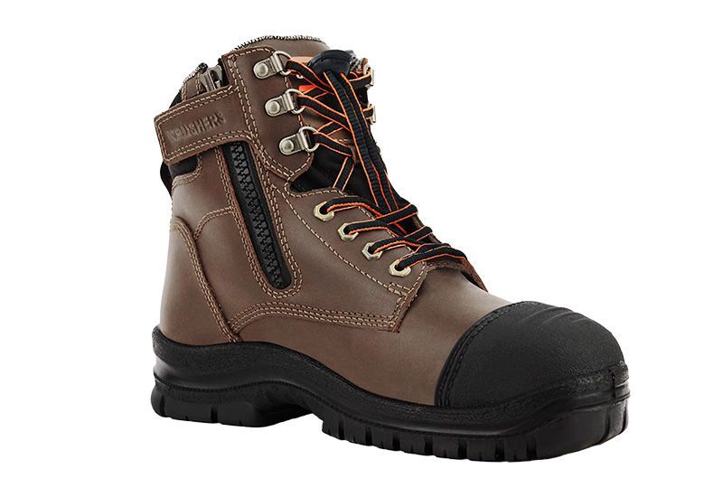 A pair of brown safety boots with a black rubber sole on a white background.