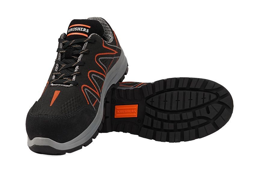A pair of black and orange safety shoes on a white background