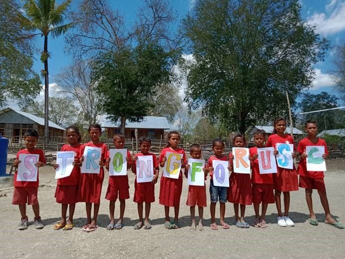 Children Holding Letters — Safety Boots in Jakarta Indonesia