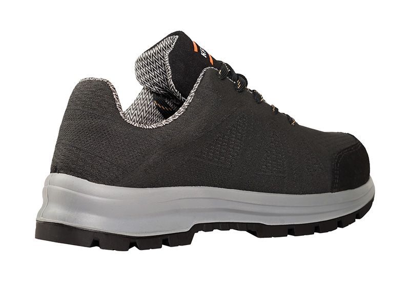 A pair of black shoes with a white sole on a white background