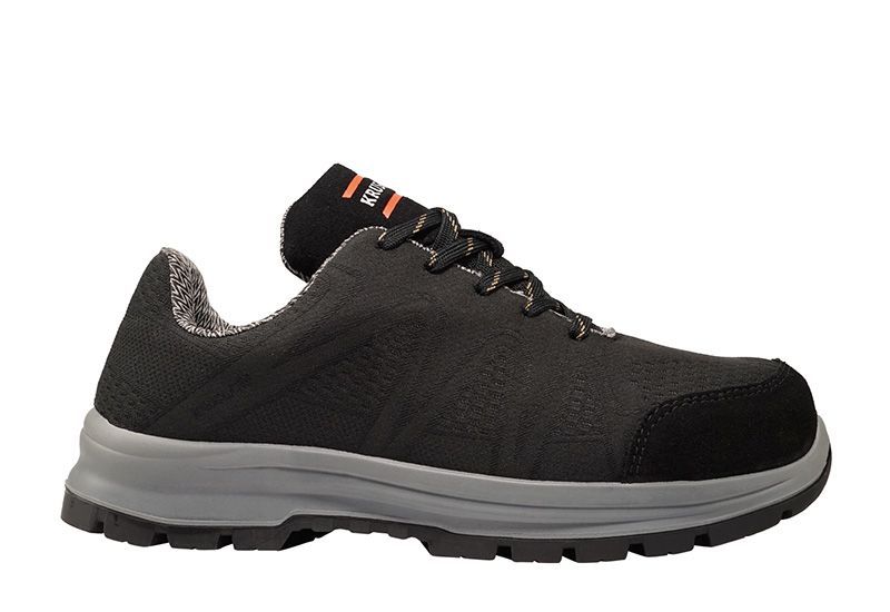 A pair of black and grey safety shoes on a white background.