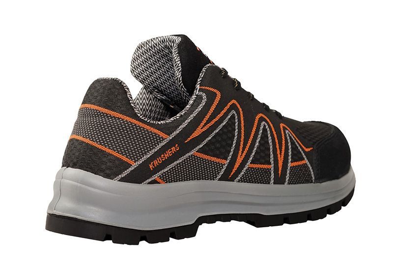 A pair of black and orange safety shoes on a white background