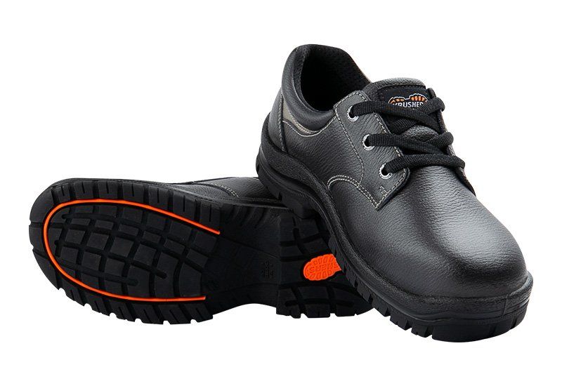 A pair of black shoes with an orange sole on a white background