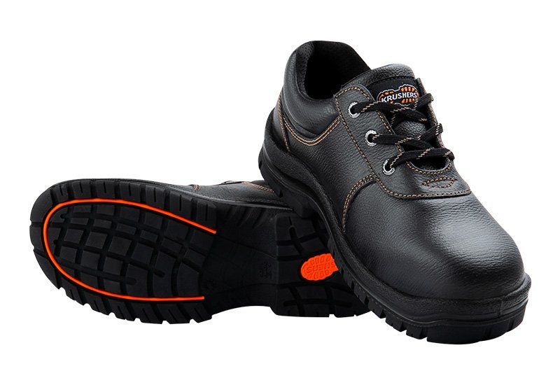 A pair of black safety shoes on a white background