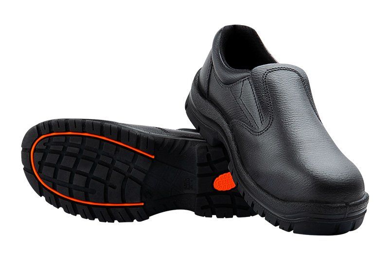 A pair of black shoes with an orange sole on a white background