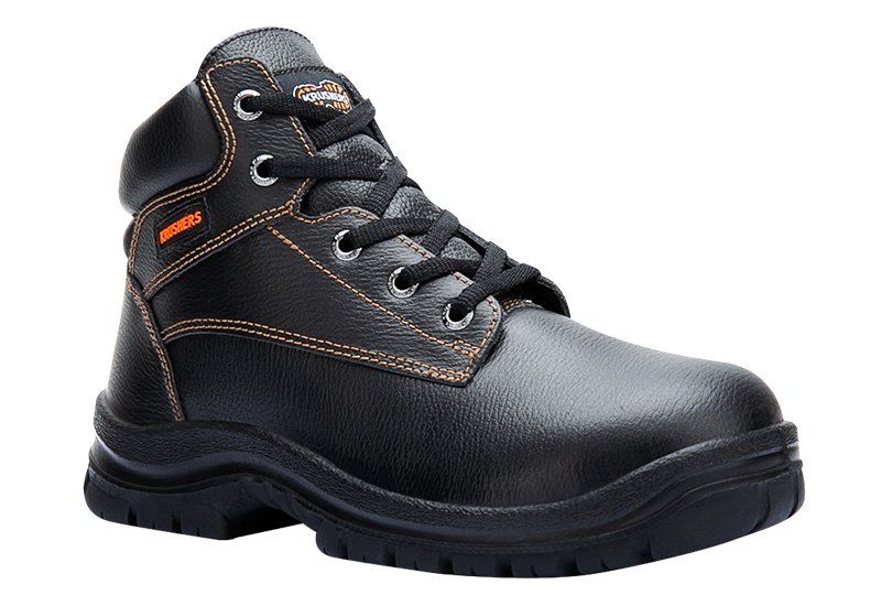 A pair of black and orange safety boots on a white background.