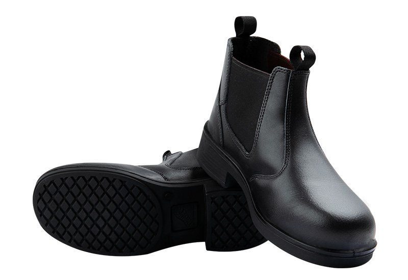 A pair of black boots with a rubber sole on a white background