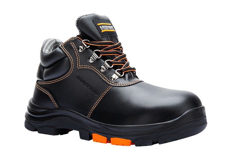 A pair of black and orange safety boots on a white background