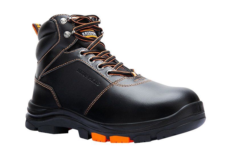 A pair of black and orange safety boots on a white background.
