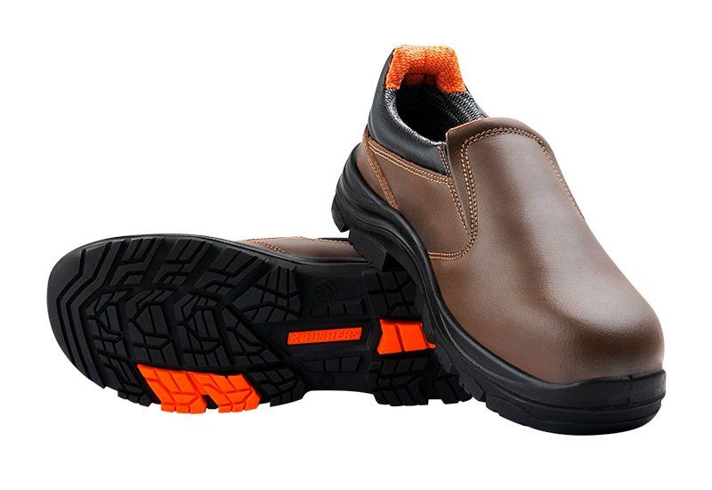 A pair of brown and black safety shoes on a white background