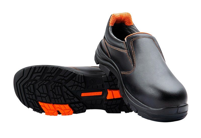 A pair of black and orange safety shoes on a white background