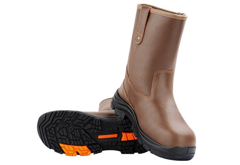 A pair of brown safety boots on a white background.