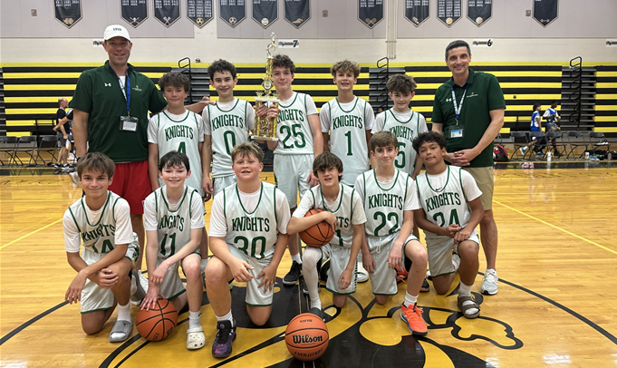 Catholic Youth Sports basketball team holding a trophy