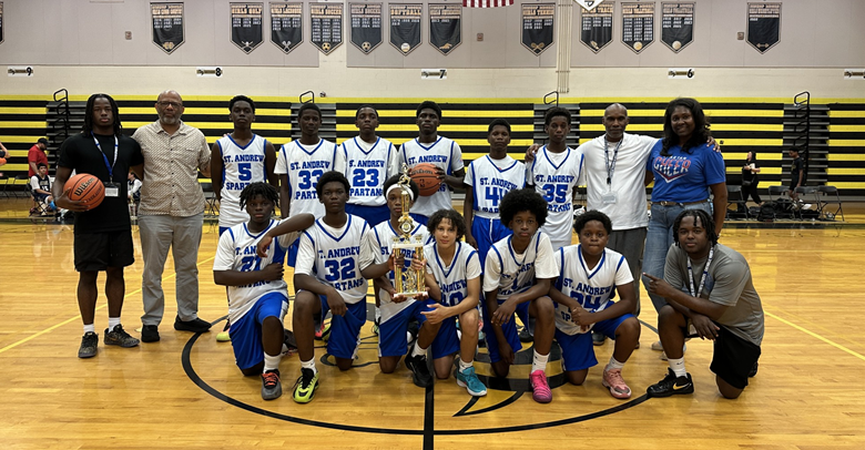 Catholic Youth Sports basketball team holding a trophy