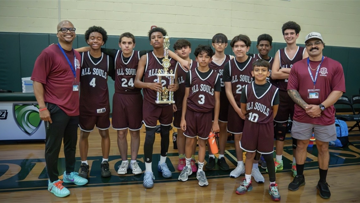 Catholic Youth Sports basketball team holding a trophy