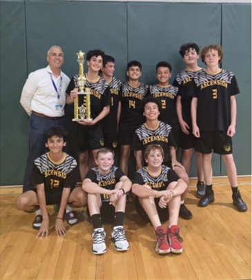 Catholic Youth Sports basketball team with a trophy
