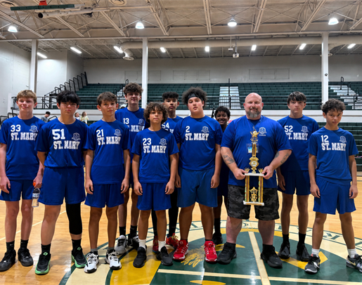 Catholic Youth Sports basketball team with a trophy