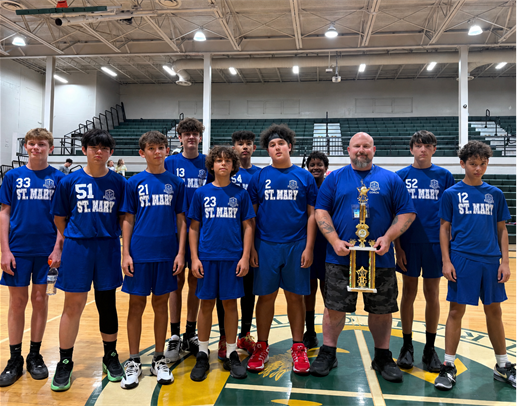 Catholic Youth Sports basketball team with a trophy