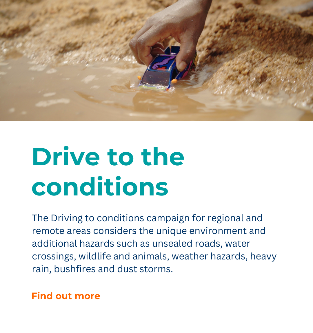 A person is holding a toy car in a puddle of water.