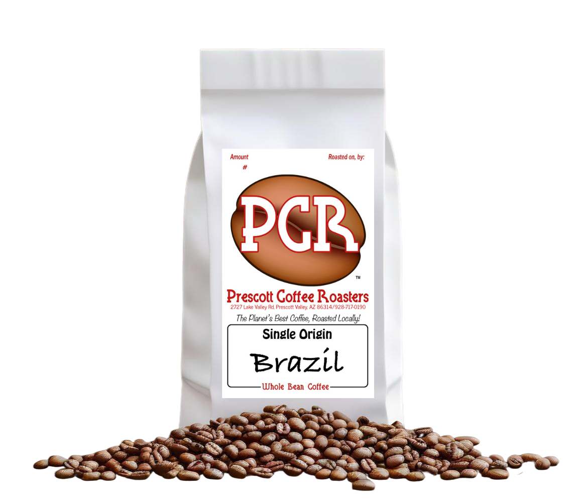 White coffee bag labeled “PCR” and “Brazil” with coffee beans spilled in front