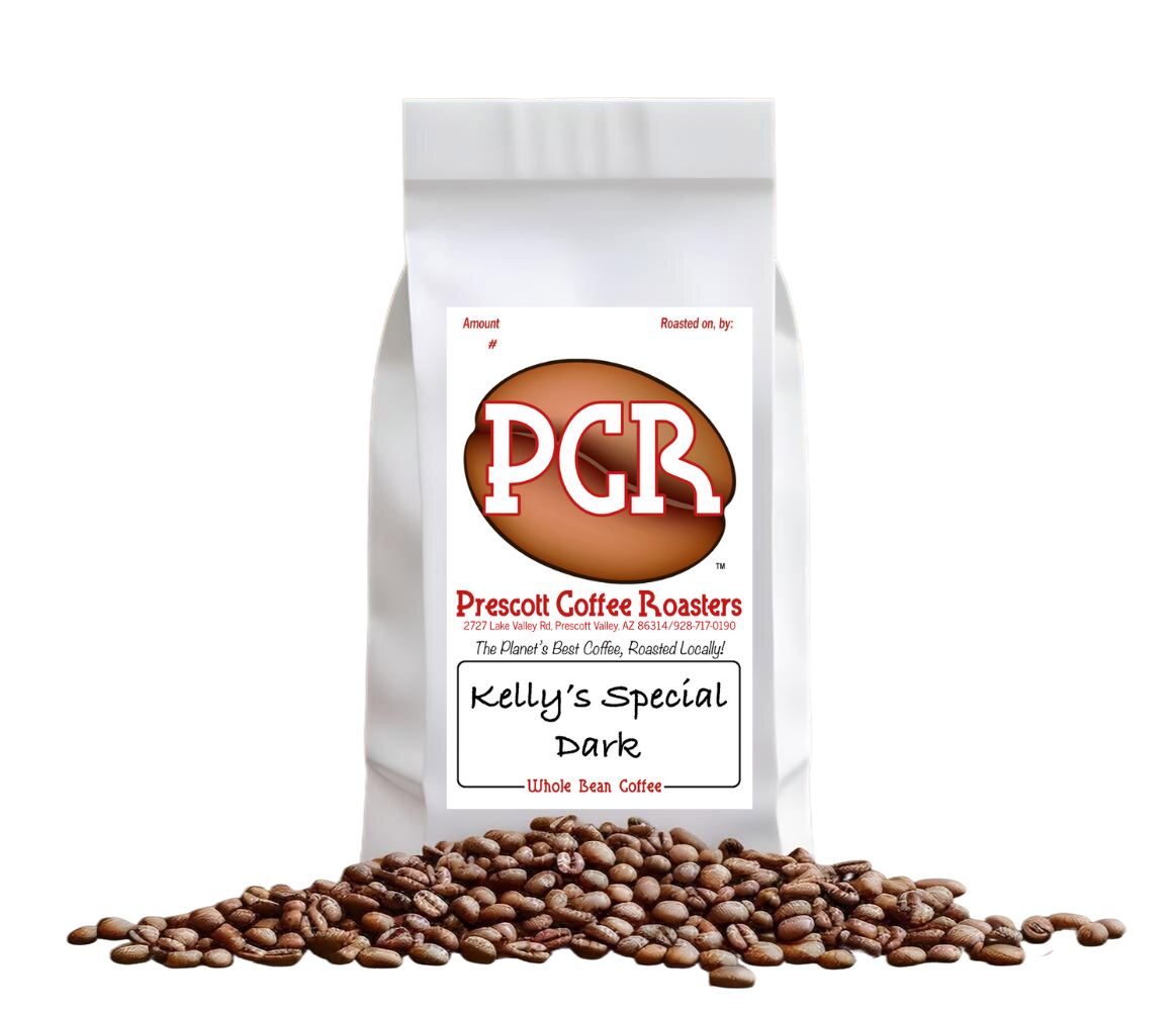 White coffee bag labeled “PCR” with coffee beans spilled in front on a plain background
