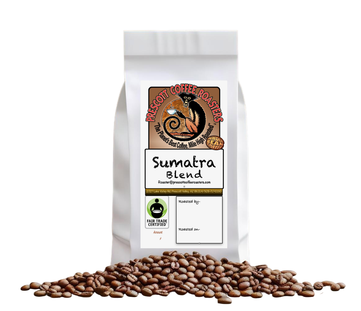 White coffee bag labeled “Sumatra Blend” with roasted coffee beans scattered in front.